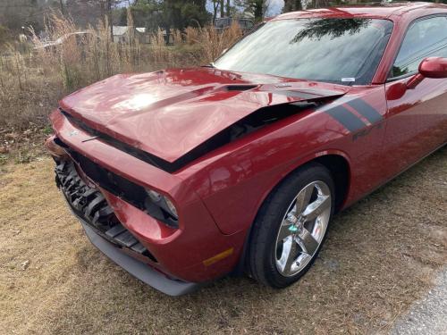 Damaged Red Dodge Challenger Side