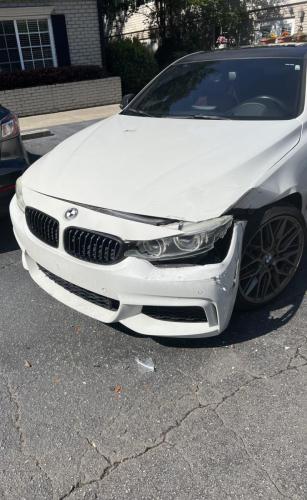 Damaged White BMW